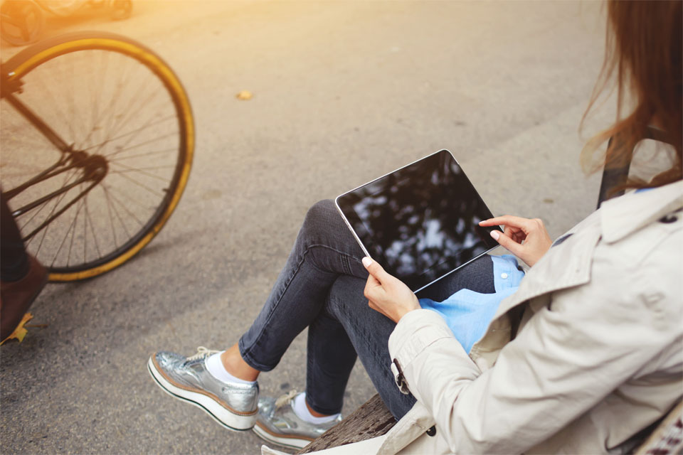 Young Hipster Girl Using Portable iPad