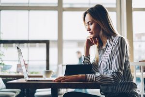 Young Woman Using Mac Laptop