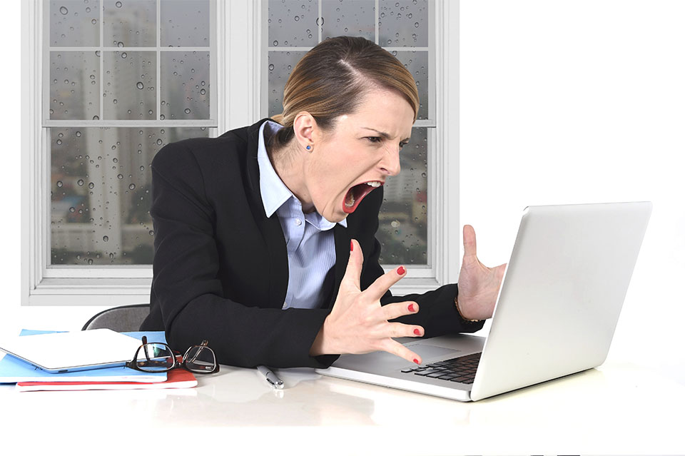 Woman Screaming at Laptop
