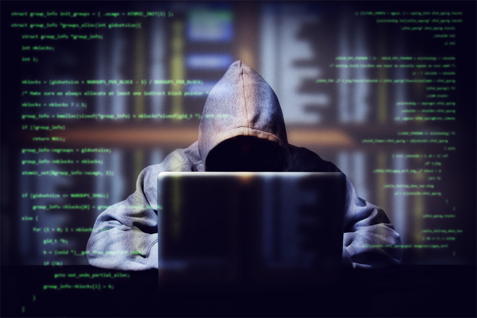 Hacker Working On Computer Code