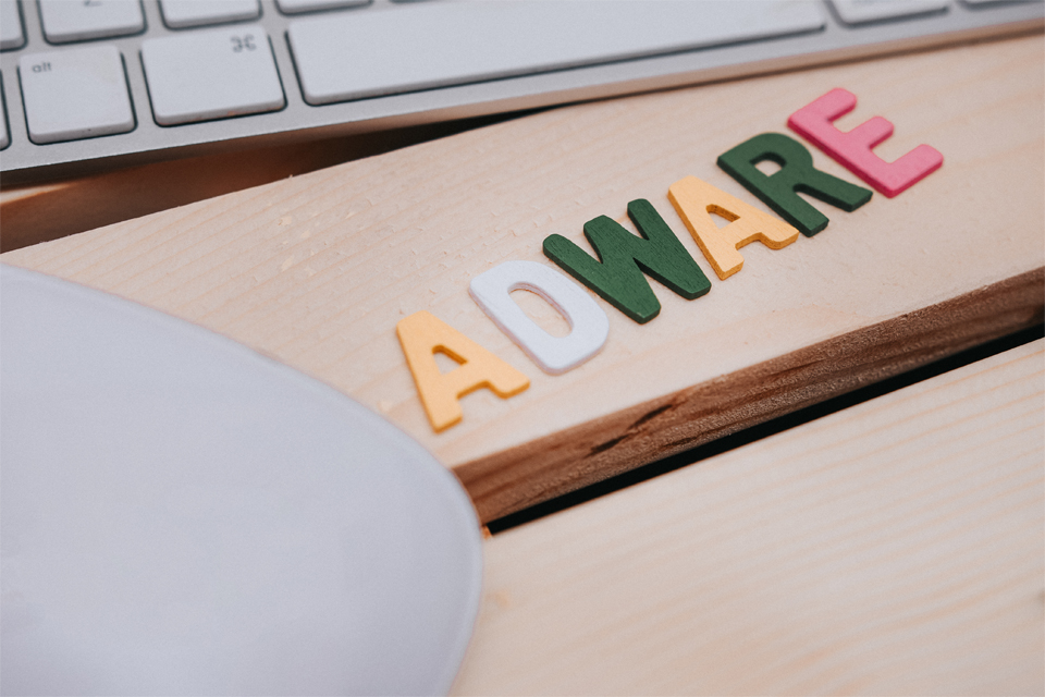 Adware Word Over Wooden Stock