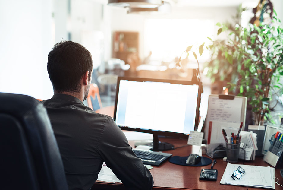 Businessman Working on Office Computer