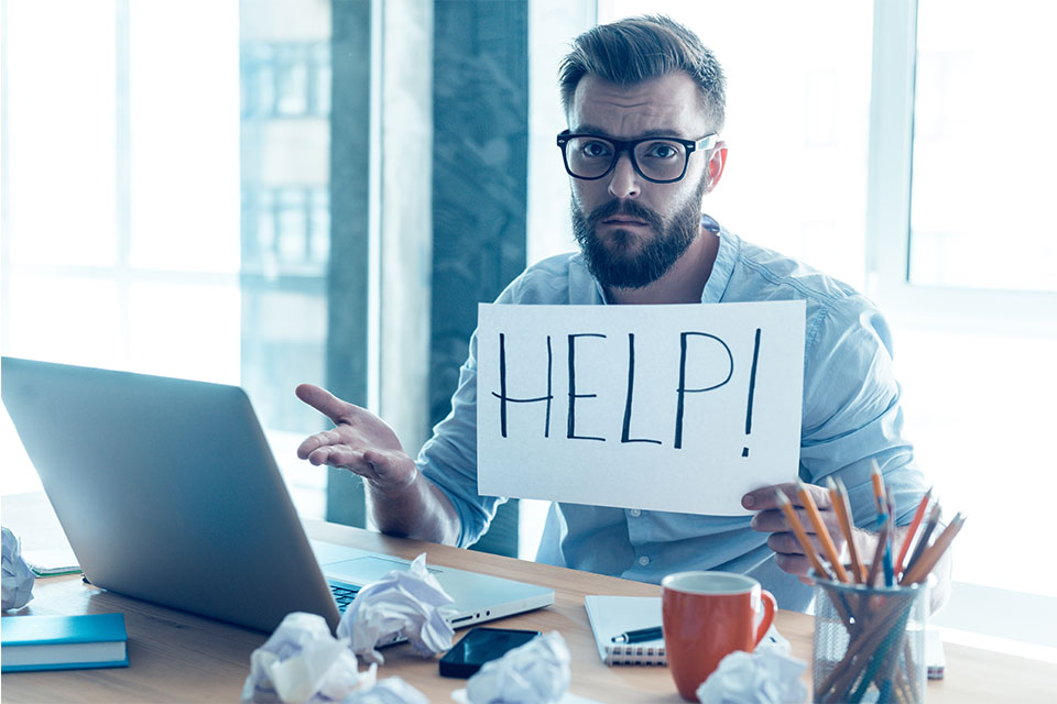 Stressed Man Asking for Help in Front of Computer