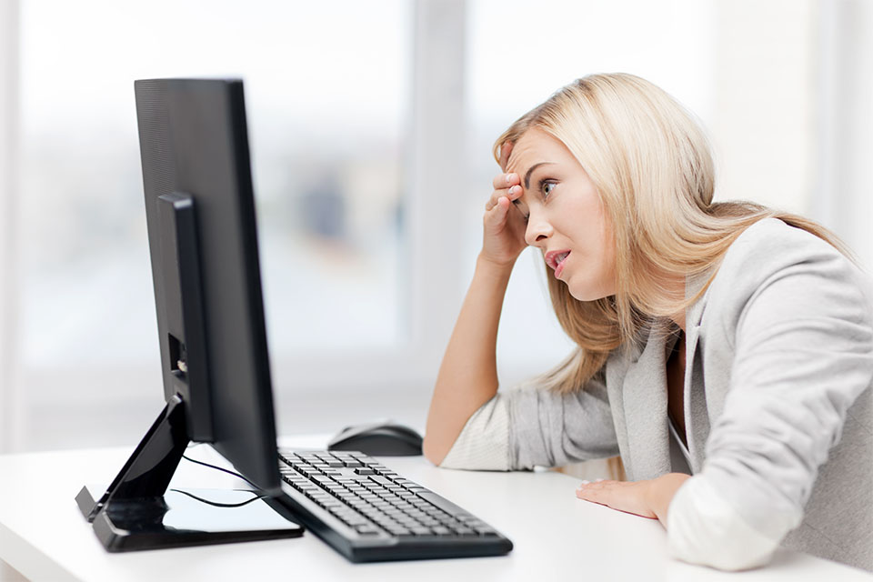 Stressed Woman in Front of Computer